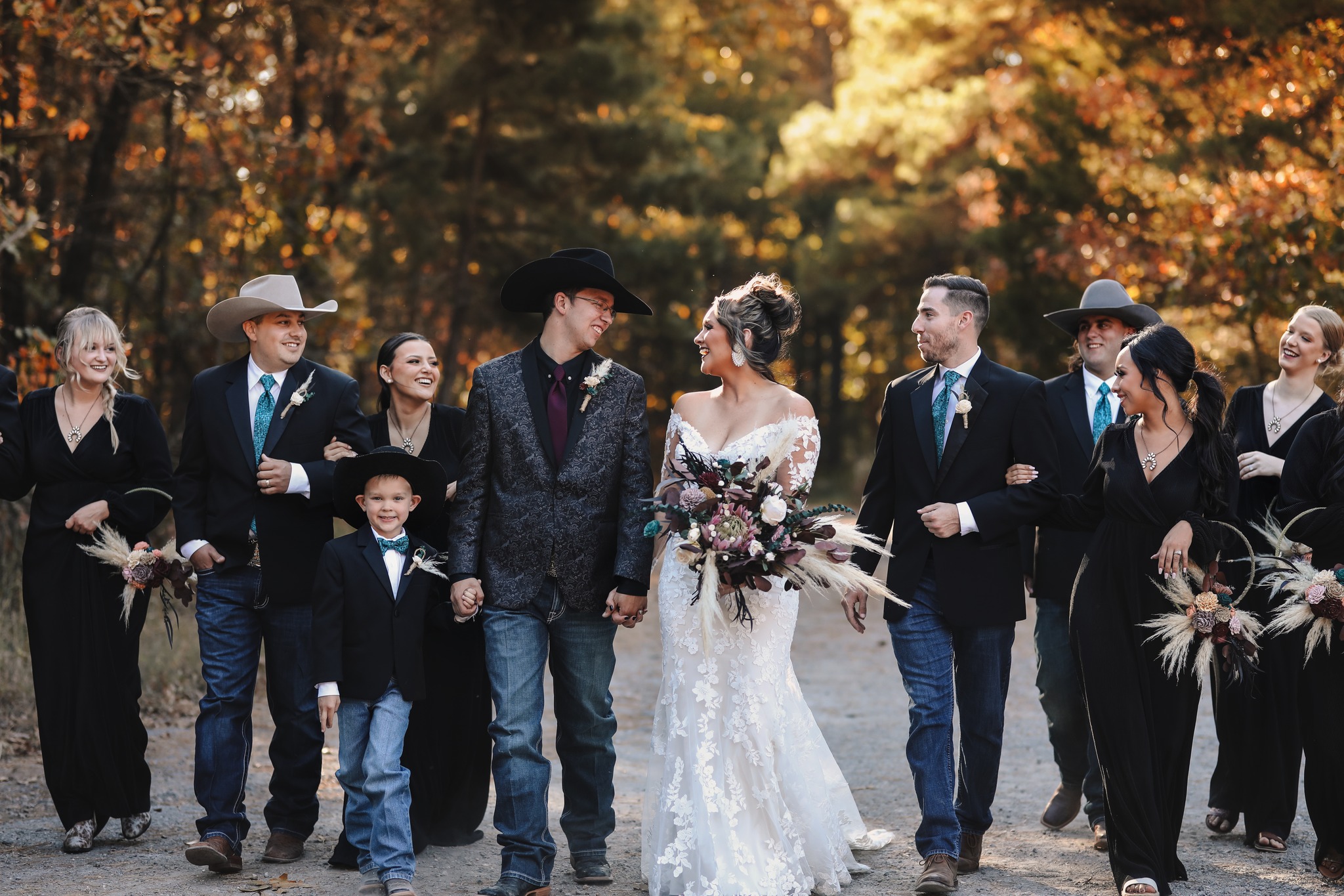 western bride and groom walking with wedding party