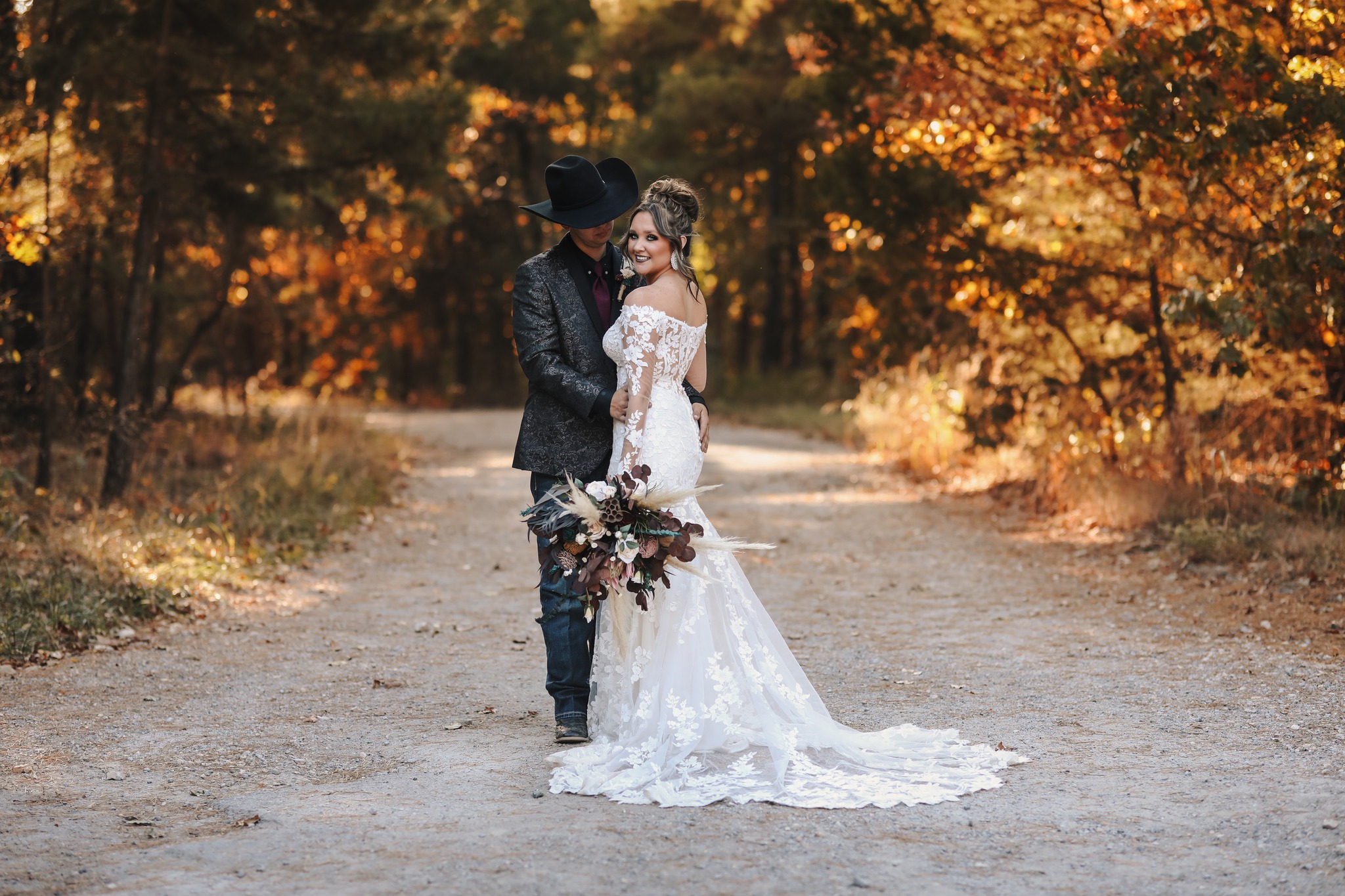 groom embracing bride