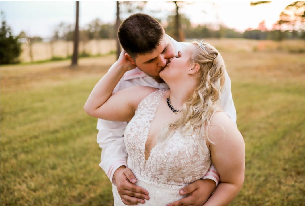 bride and groom kissing