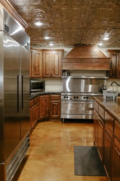 spacious kitchen with commercial refrigerator