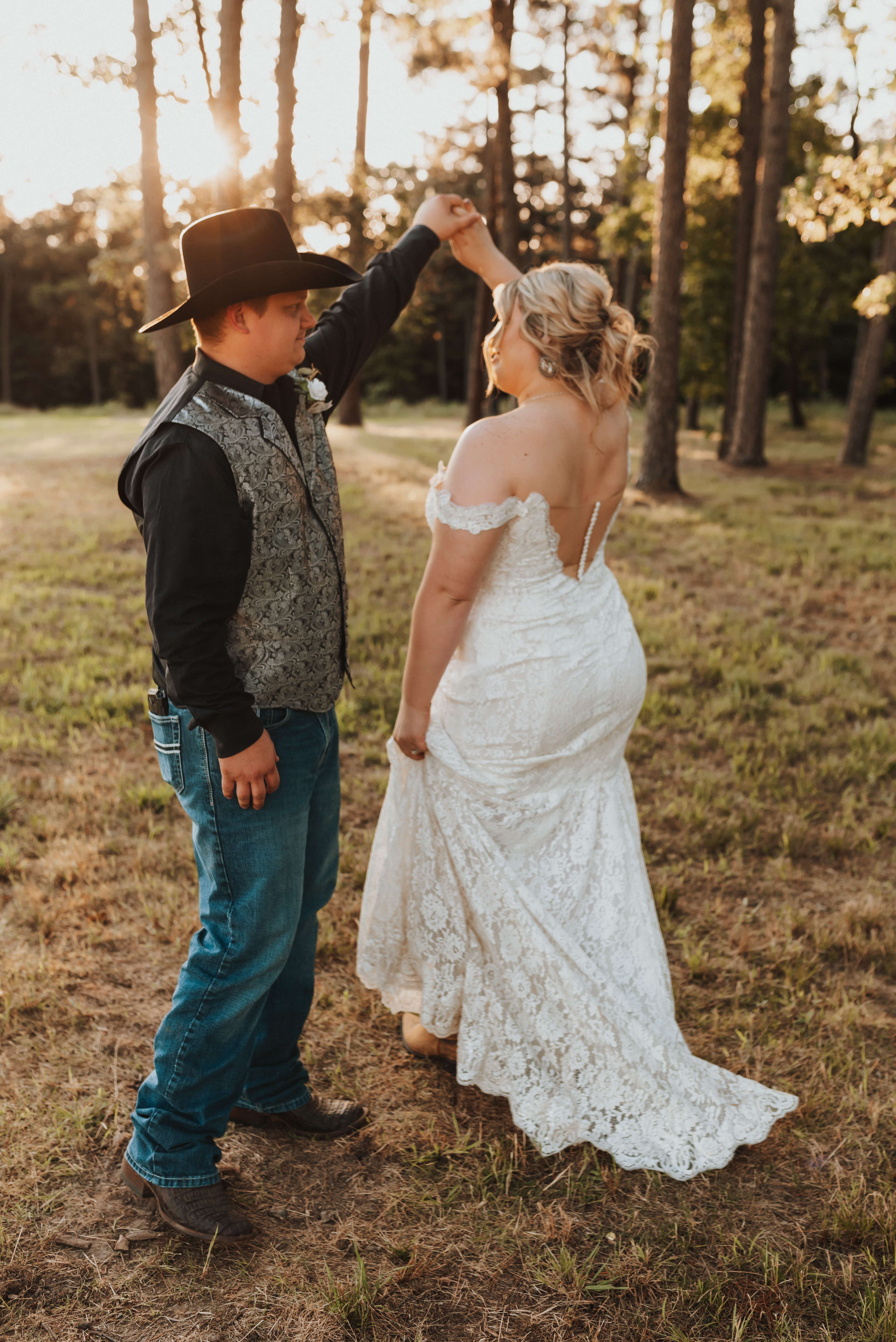 groom twirling bride