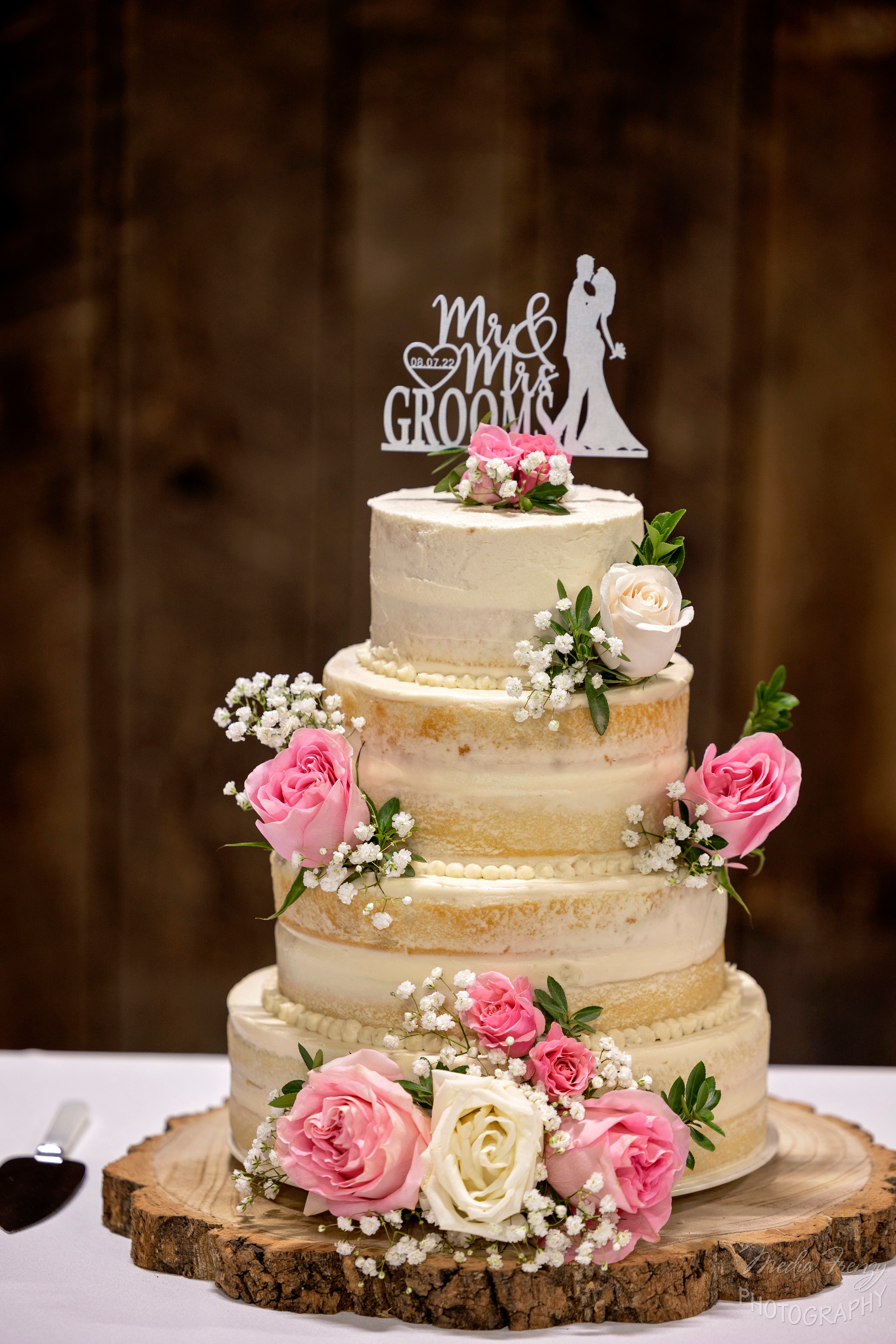 rough iced wedding cake with pink roses
