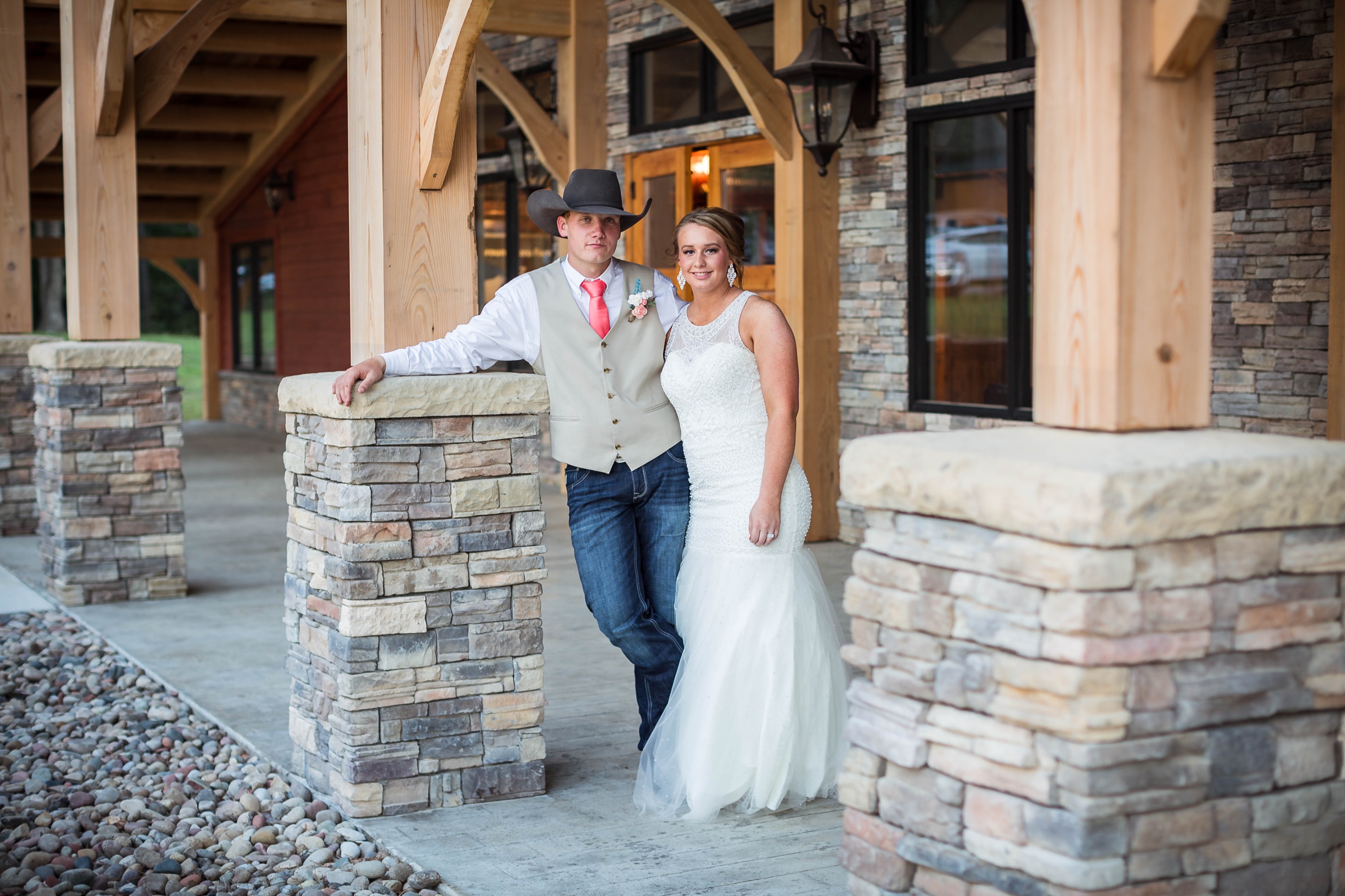 bride and groom on venue porch
