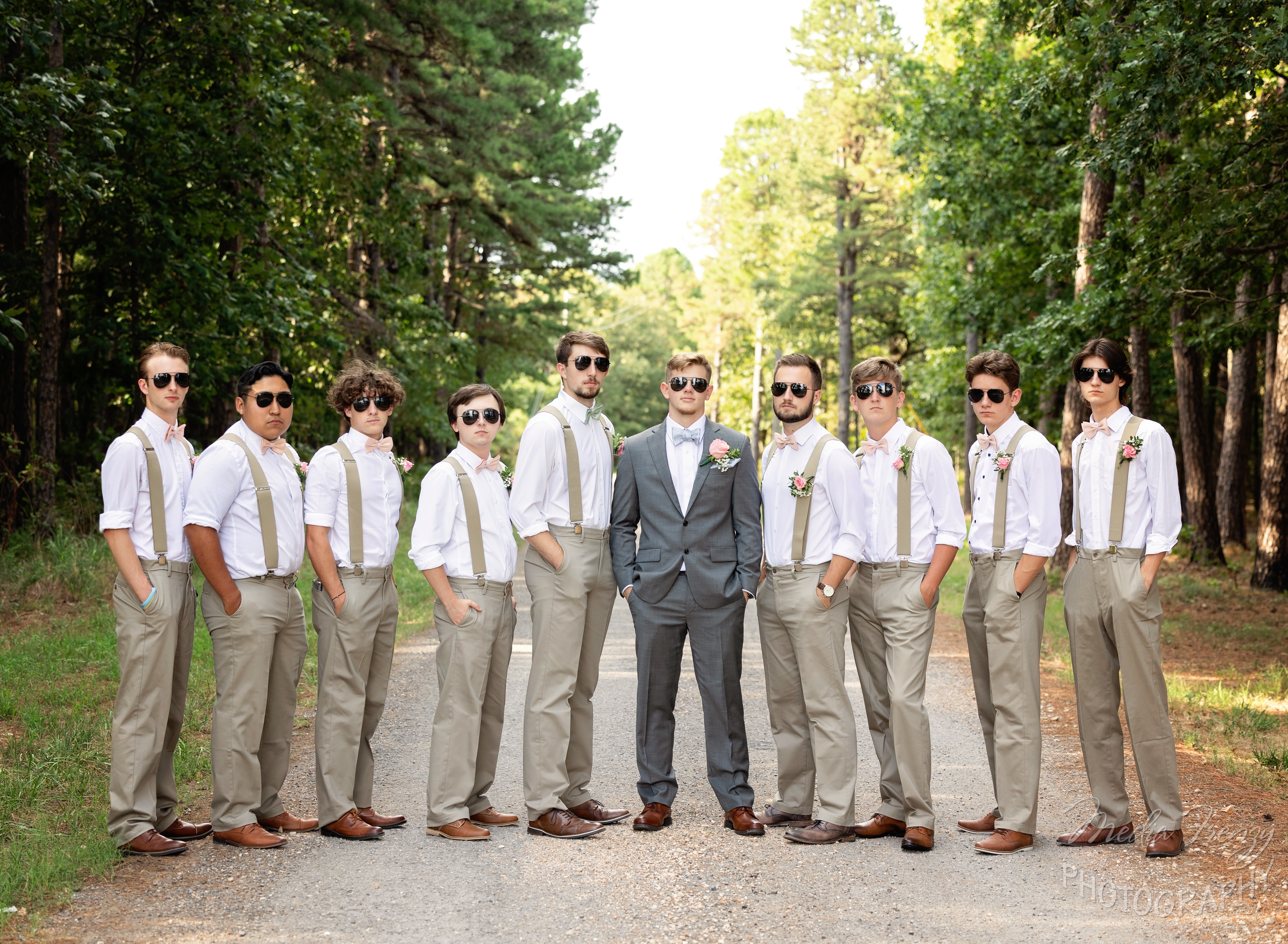 groom and groomsmen in tan suits